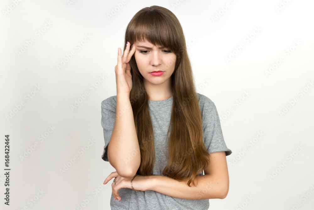 Portrait of a pretty woman stress and headache having migraine pain Portrait of a pretty woman stress and headache having migraine pain