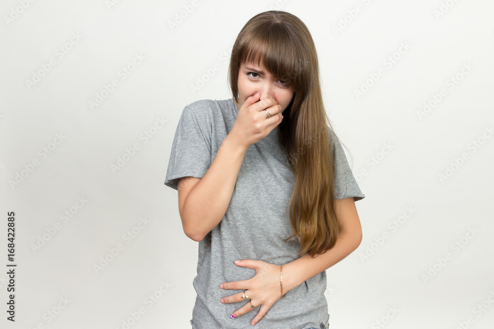Portrait of a pretty woman with stomach issues she want to puke Portrait of a pretty woman with stomach issues she want to puke