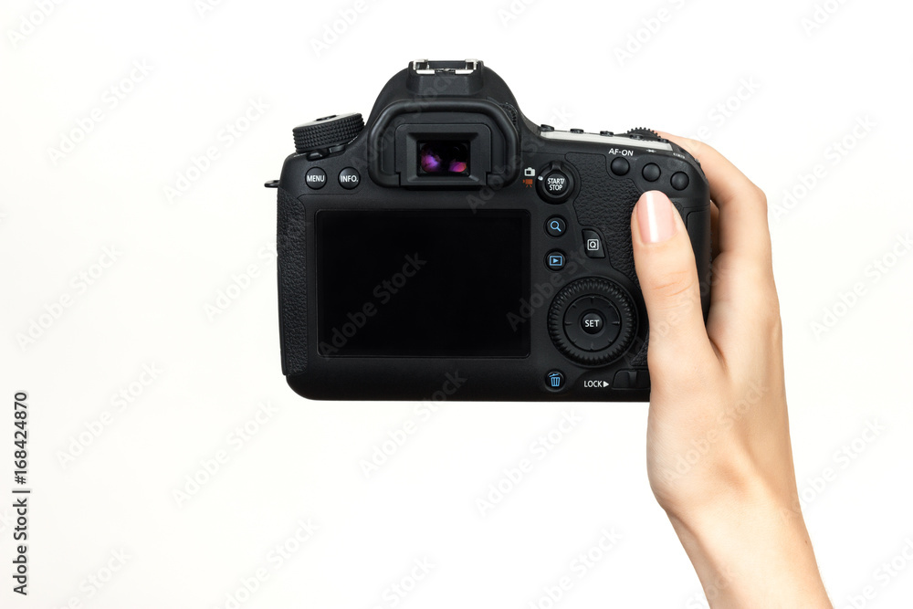 DSLR camera in hand DSLR camera in hand