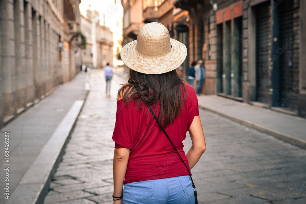 Tourism in Europe, woman tourist walking on the street