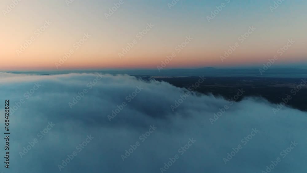 Aerial drone shot of low laying clouds right after the sunset Aerial drone shot of low laying clouds right after the sunset