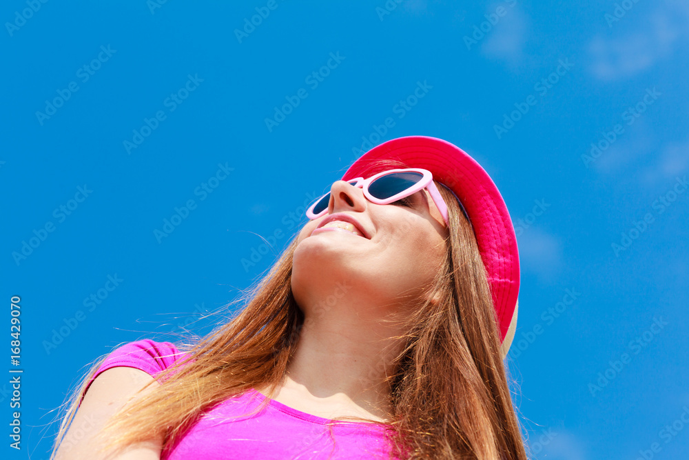 Woman wearing heart shaped sunglasses and hat Woman wearing heart shaped sunglasses and hat