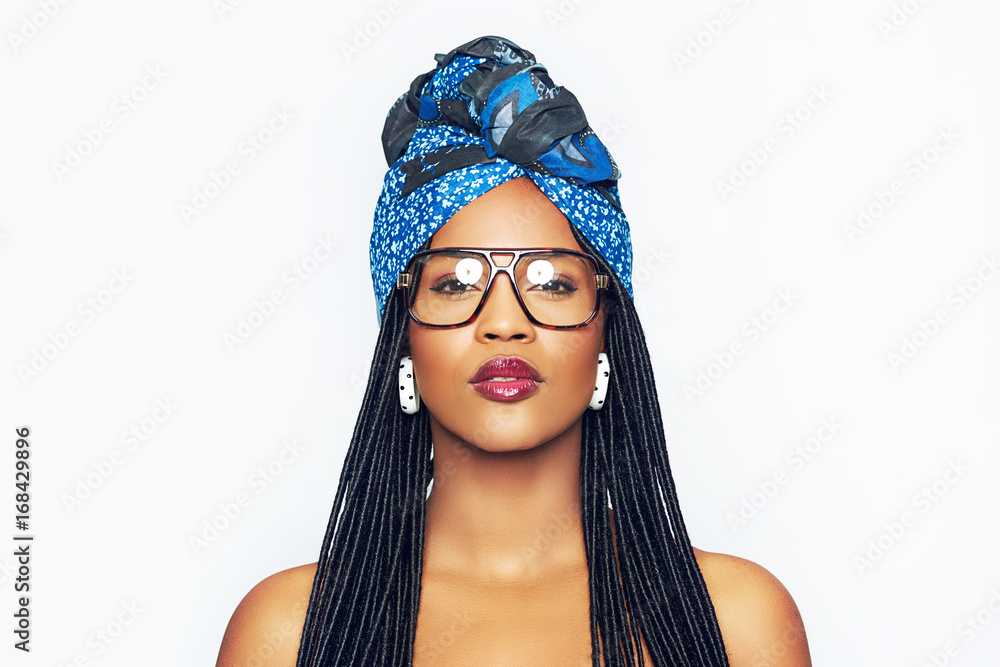 Sensual black woman wearing glasses and ethnic head wrap Stock Photo