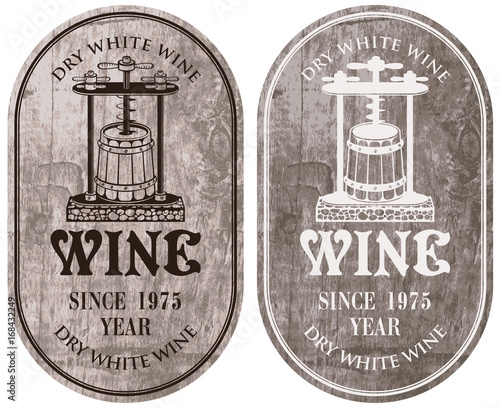 Set of vector labels for dry white wine with a wine press and barrel in retro style on wooden background