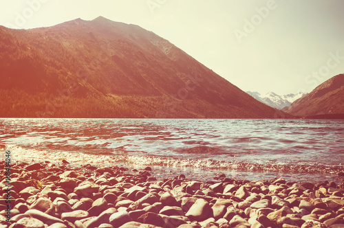 Multinskoe lake with crystal clear fresh water in the Altai mountains. photo