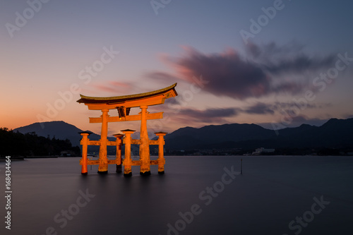 Floating torii gate in miyajima island, hiroshima. photo