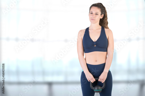 Woman Working Out With a Kettlebell © ruigsantos