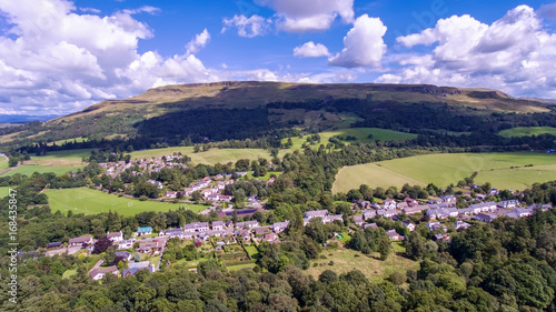 Aerial view of the village of Fintry with hills in the distance photo