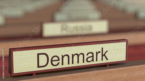 Denmark name sign among different countries plaques at international organization. 3D rendering