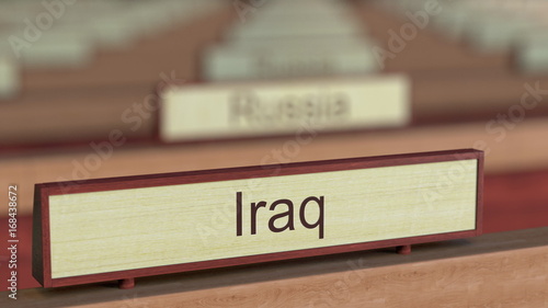 Iraq name sign among different countries plaques at international organization. 3D rendering photo