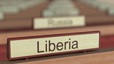 Liberia name sign among different countries plaques at international organization. 3D rendering
