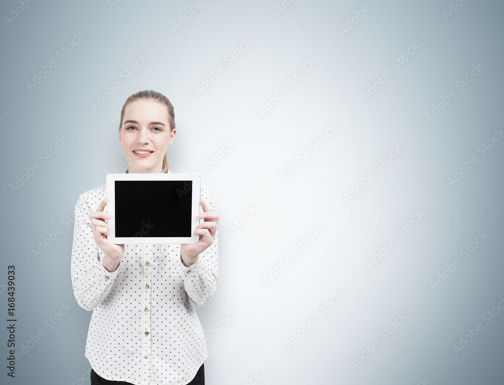Businesswoman in a polka shirt with a tablet, gray Businesswoman in a polka shirt with a tablet, gray