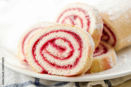 Wallpaper Mural Fresh sweet roll with strawberry jam and powdered sugar on a plate and white towel Torontodigital.ca