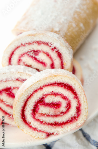 Wallpaper Mural Fresh sweet roll with strawberry jam and powdered sugar on a plate and white towel Torontodigital.ca