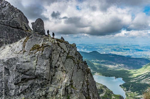 Poland, tatra mountains landscape, tourists on the Eagle's Path (Orla Perc) ridge