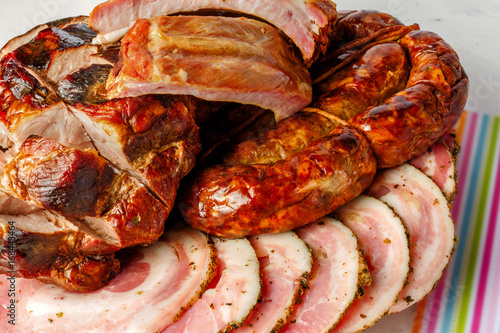 Fototapeta Homemade sausage, smoked ribs and sliced meatloaf