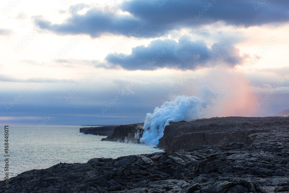 Volcano lava tube spilling into the ocean at dusk
