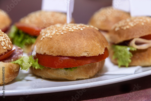 Mini burgers served on a plate