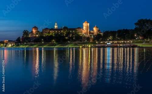 Krakow, Poland, panorama of Wawel Castle from the Vistula river boulevards in the evening