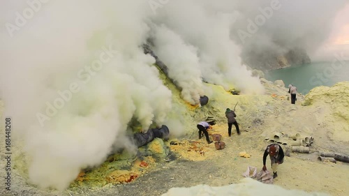 Sulfur miners inside crater of Ijen volcano in East Java, Indonesia timelapse.
