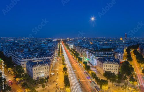 Moonrise over the Champs-Elysees in Paris at nightfall