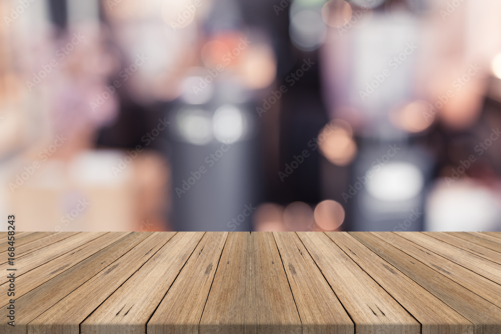 Empty wood table top on blurred background,for montage your products Empty wood table top on blurred background,for montage your products