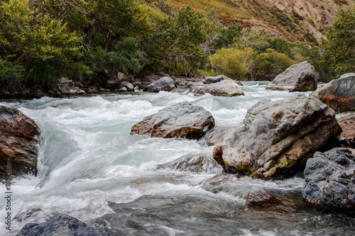 in summer rocky mountain river water silk. mountain river