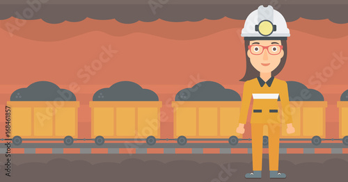 A woman in hardhat with torch on the background of mining tunnel with cart full of coal vector flat design illustration. Horizontal layout. 