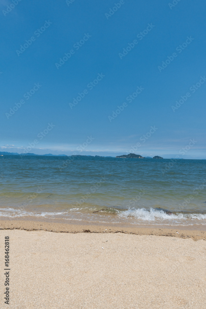 A wave each of Setonaikai (Seto Inland) Sea under blue sky at Saijo-city in Ehime, Japan A wave each of Setonaikai (Seto Inland) Sea under blue sky at Saijo-city in Ehime, Japan