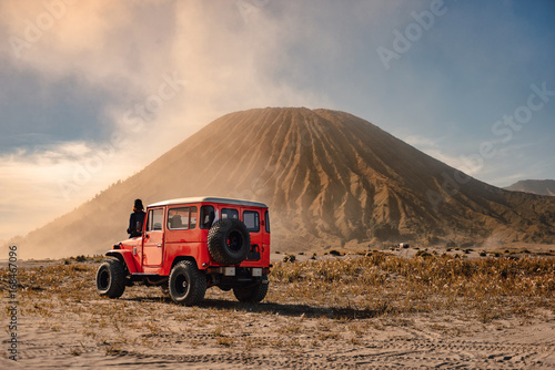 4x4 car service for tourist on desert at Bromo Mountain, Mount Bromo is one of the most visited tourist attractions in Java, Indonesia photo