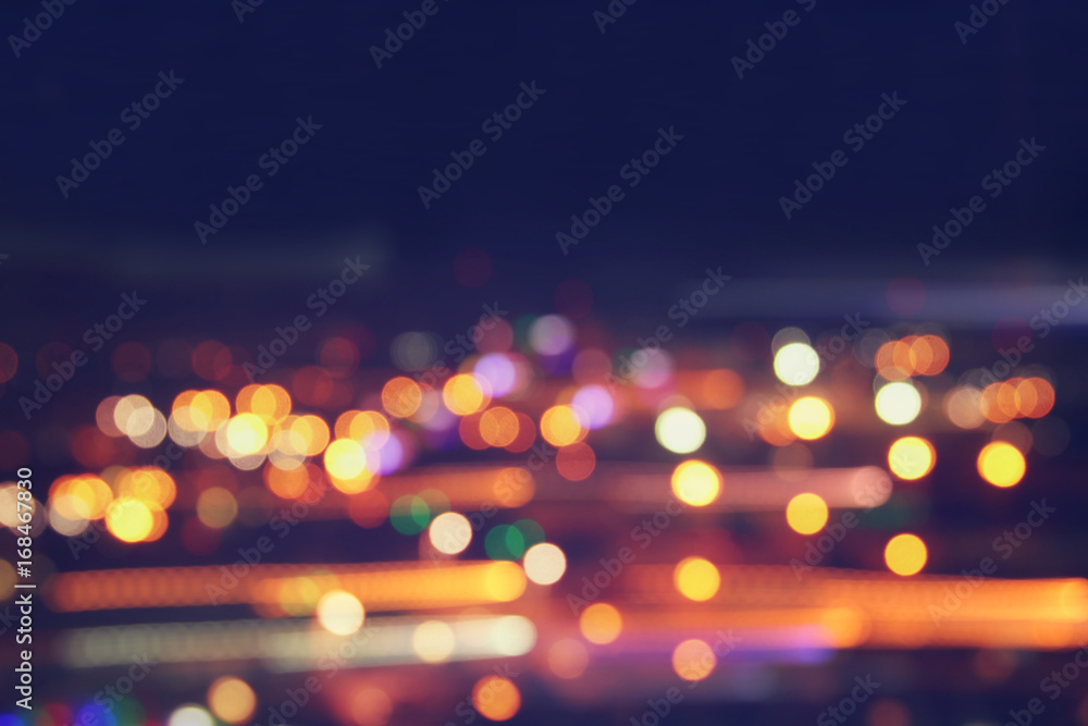 image of colorful blurred defocused bokeh Lights. motion and nightlife concept