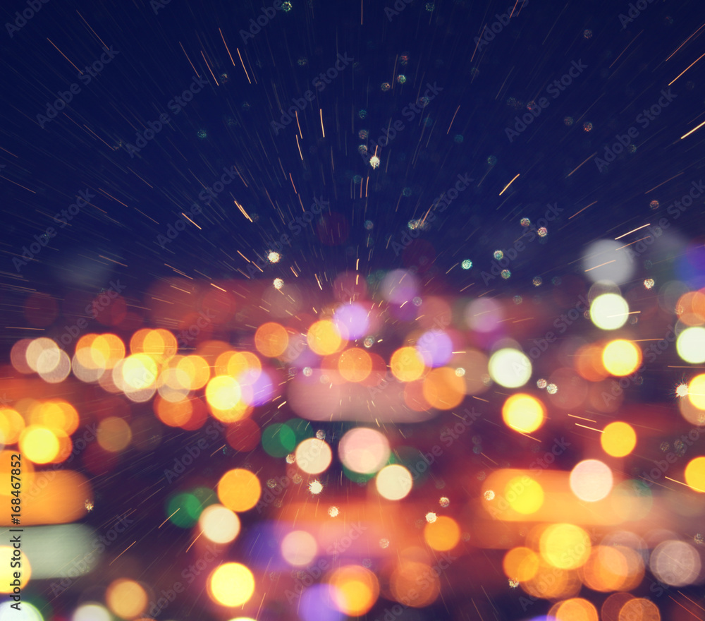 image of colorful blurred defocused bokeh Lights. motion and nightlife concept