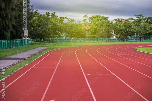 Red running track in stadium,running track on blue sky