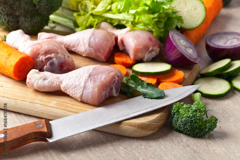 Close-up of chicken drumsticks with vegetables Close-up of chicken drumsticks with vegetables