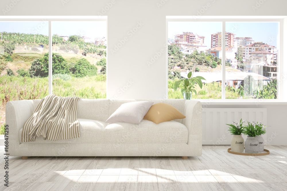Fototapeta premium Idea of white room with sofa and summer landscape in window. Scandinavian interior design. 3D illustration