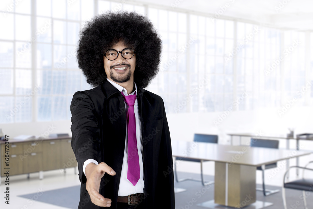 Fototapeta premium African male entrepreneur offering shaking hand