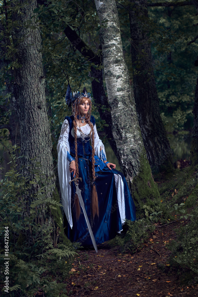 Valkyrie warrioress in magpie costume. Styling for the Scandinavian women's costume of the Viking Age. Valkyrie warrioress in magpie costume. Styling for the Scandinavian women's costume of the Viking Age.