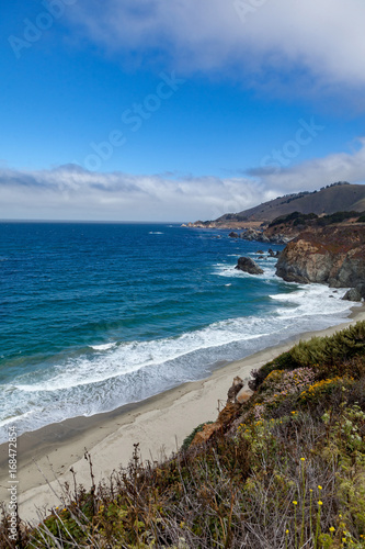 Empty beach and cliff view of Big Sur California