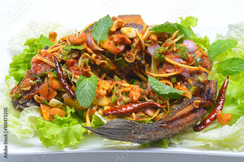 fried snakehead fish serve with herb and spicy sauce