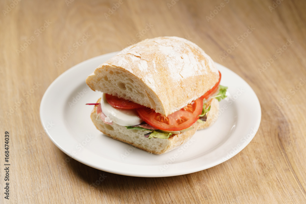 ciabatta sandwich with speck, mozzarella and vegetables ciabatta sandwich with speck, mozzarella and vegetables