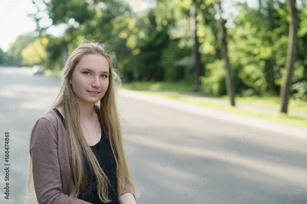 teen girl portrait in town in sunny summer day teen girl portrait in town in sunny summer day
