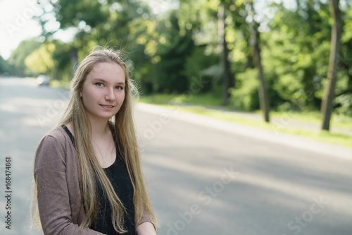 teen girl portrait in town in sunny summer day