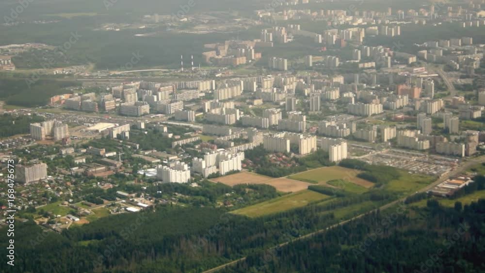 The view from the window of the plane on the high-rise buildings over the Moscow region. The view from the window of the plane on the high-rise buildings over the Moscow region.