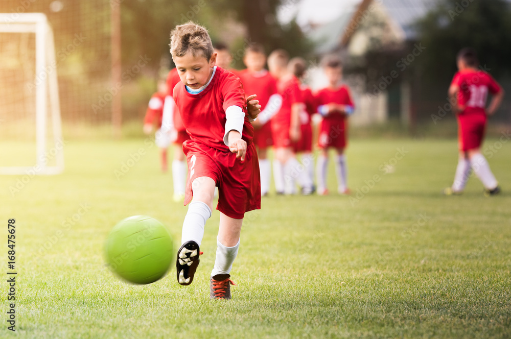 Kids soccer football - children players match on soccer field Kids soccer football - children players match on soccer field