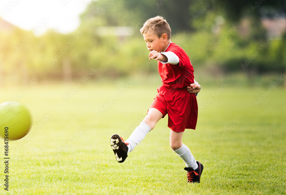 Obraz premium Kids soccer football - children players match on soccer field