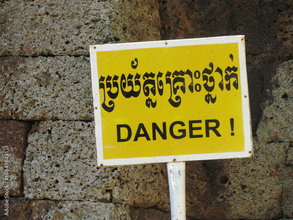 Danger word sign in english and Cambodian Khmer Danger word sign in english and Cambodian Khmer