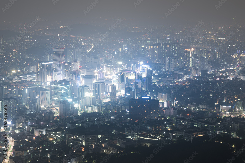 view on night highlighted Seoul city from N tower streets full of lights. South Korea.