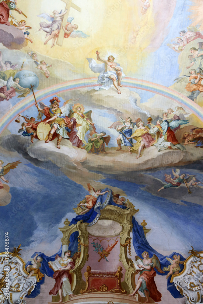 Old religious shows painted on the ceiling of the church