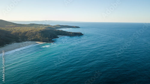 Drone shot of the coastline of sunshine beach towards Coolum at sunset.