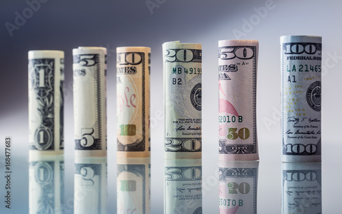 Dollar. American dollar banknotes rolled in different positions